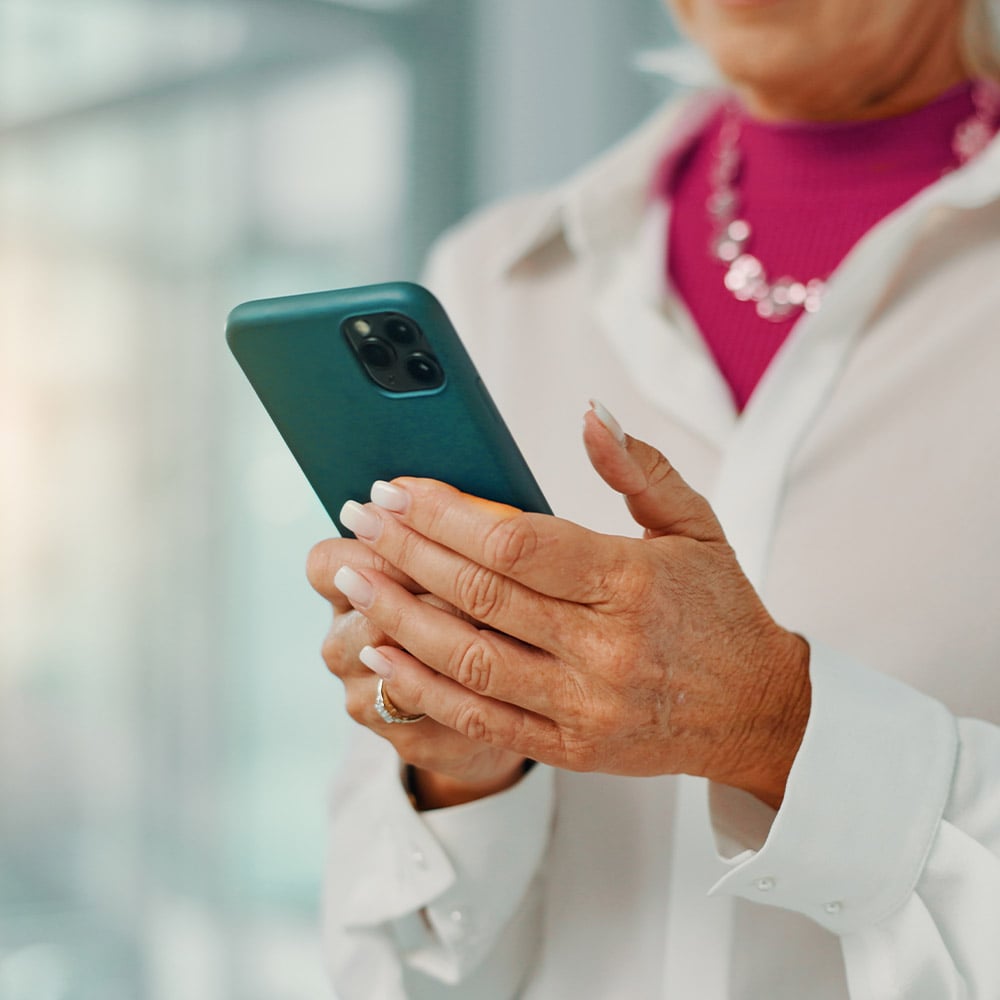 Close up of hands holding a smartphone